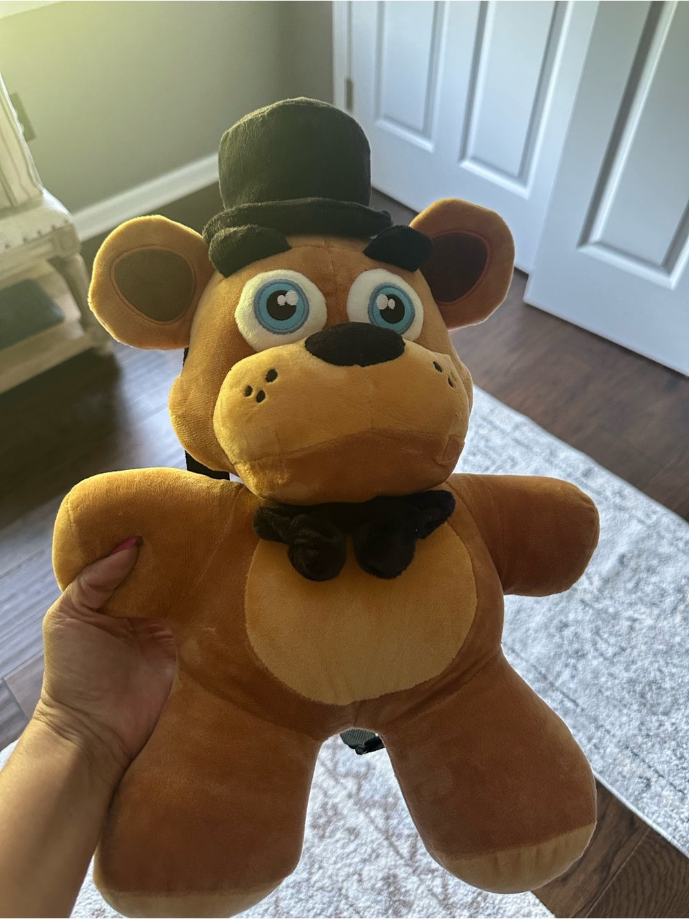 Five Nights at Freddy’s Plush Brown Bear with Top Hat has straps on back.
